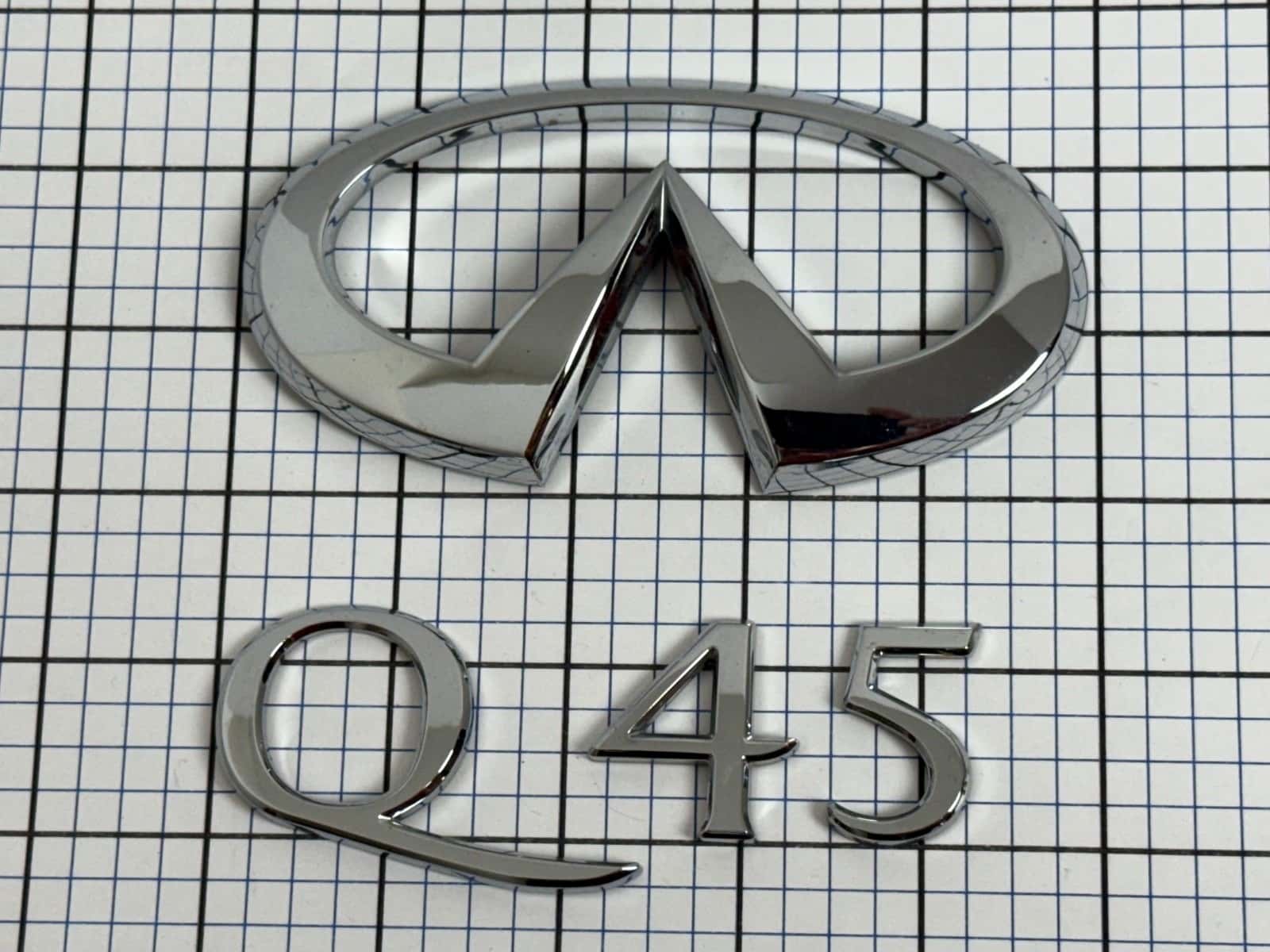 Infiniti Q45 sedan 2001 trunk emblem badge logo OEM Factory Genuine