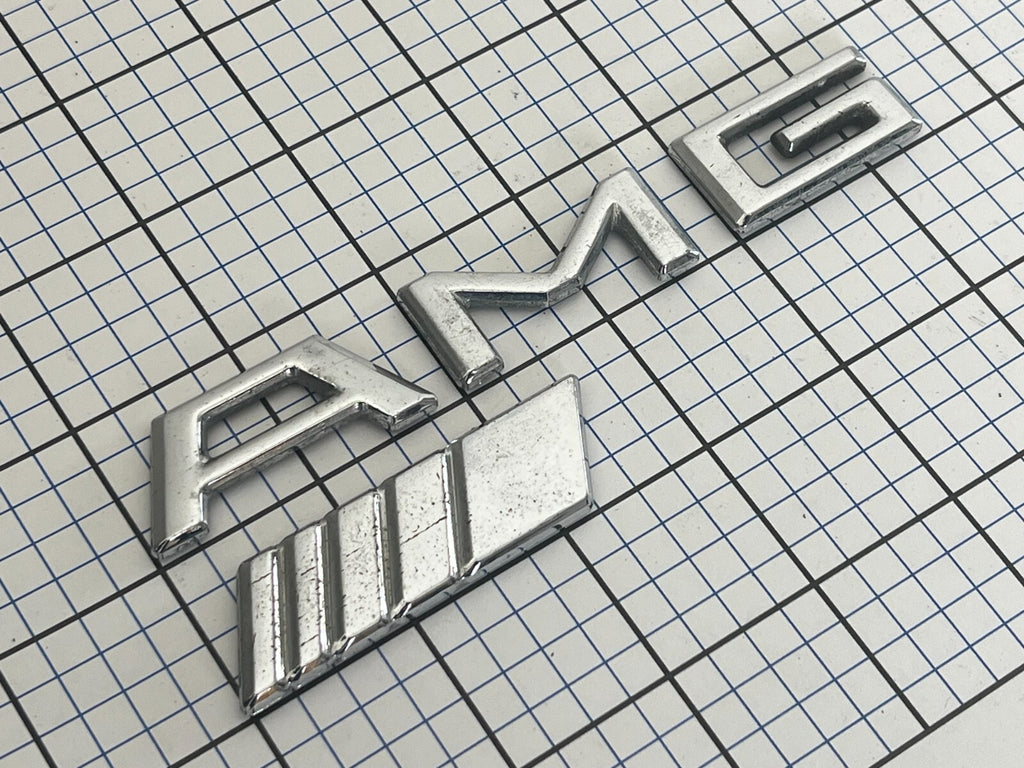 Mercedes Benz AMG rear emblem  badge logo letters OEM Genuine