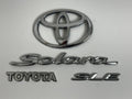 2004-2007 Toyota Solara SLE XV30 OEM rear liftgate emblem set 75442-AA040