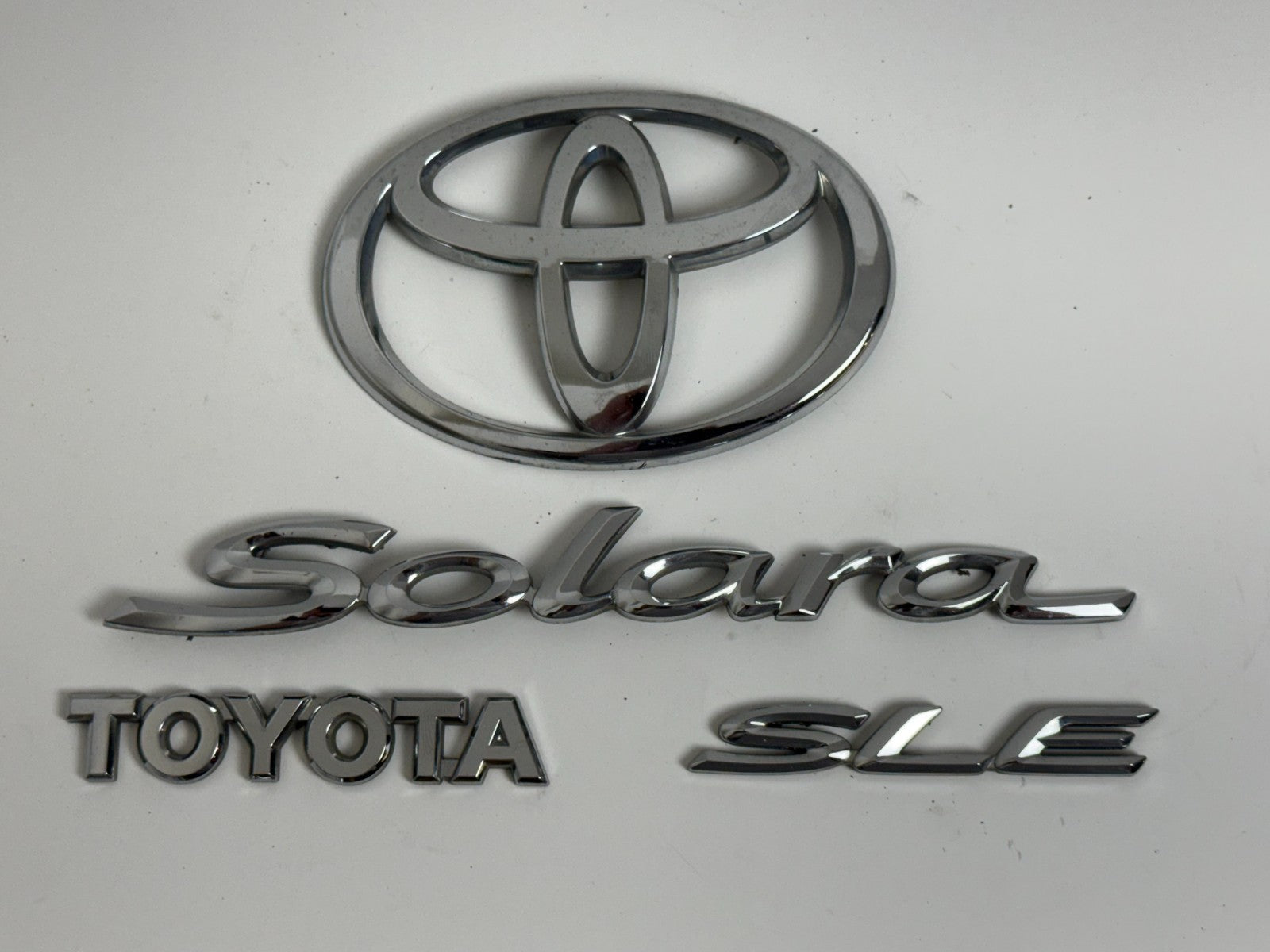 2004-2007 Toyota Solara SLE XV30 OEM rear liftgate emblem set 75442-AA040