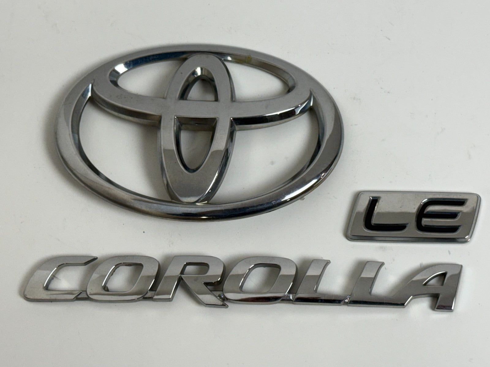 2011-2013 Toyota Corolla LE OEM rear liftgate emblem set 75442-02380